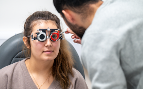 Optometry students practicing an eye exam