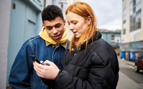 Students looking at a phone
